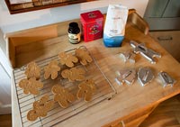 Gingerbread men on drying rack in kitchen 