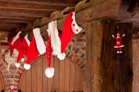 Christmas decorating hanging from wood beam 