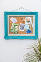 Pin board made with painted ornate picture frame and cork 