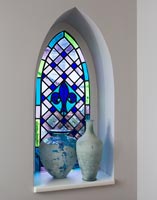 Modern stained glass window with vases 