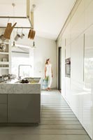 Modern Kitchen with woman and shopping