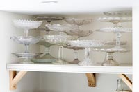 A collection of glass cake stands