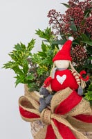 Nordic figurine in Christmas arrangement with Holly and Skimmia