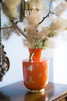 Flower arrangement in ornate vase 