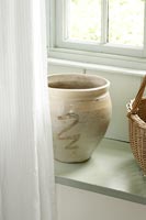 Ceramic pot in window 