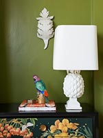 Ornate lamp on sideboard 
