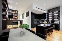 Open plan kitchen-diner with view to corner home office