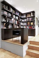 Home office on raised area with hidden storage 