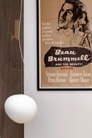 Movie poster and modern white lamp