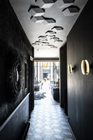Black modern corridor with textured ceiling