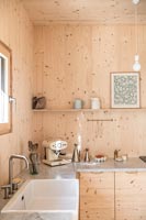 Butler sink in modern timber clad country kitchen