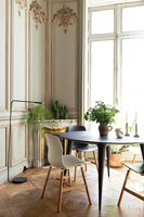 Classic dining room with small modern tulip style dining table 