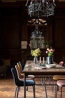 Modern table and chairs in classic dining room with period features 