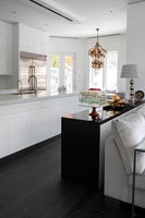 White open plan kitchen with sideboard dividing space 