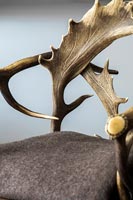 Armchair back made using deer antlers 