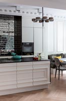 Large modern kitchen-diner with island,  tiled feature wall and period details 