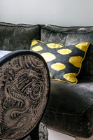 Black and yellow cushion on sofa 