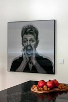 Large black and white portrait of David Bowie on kitchen wall 