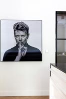 Large black and white portrait of David Bowie on kitchen wall 