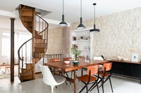 Modern dining room with spiral staircase 