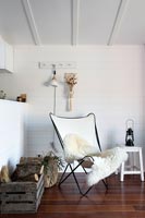 Modern country living room with white butterfly chair 