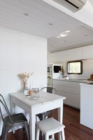 White painted small modern kitchen-diner 
