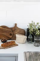Chopping boards and accessories on kitchen worktop 