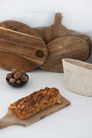 Wooden chopping boards and food on kitchen worktop