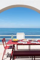 Outdoor dining area with sea views 
