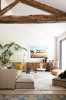 Exposed wooden beams in modern living room 