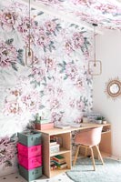 Floral wall paper on feature wall and ceiling around desk