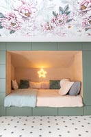 Alcove bed with built-in storage in childrens bedroom 