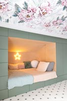Built-in storage around alcove bed in modern childrens bedroom 