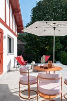 Modern chairs and table on terrace in summer 