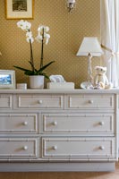 White chest of drawers in classic style bedroom 