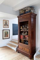 Old wooden shelving unit in modern country hallway 