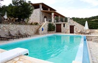 Swimming pool and stone house 
