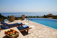 Swimming pool and recliners with sea views 