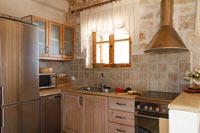 Stone tiling in wooden country kitchen 
