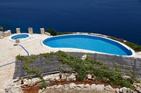 Overview of swimming pool with sea views 