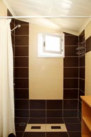 Black and white tiled shower cubicle 