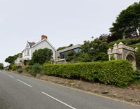 Exterior of country house viewed from road 