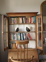 Wooden unit with book shelves over bureaux 