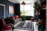 Modern living room with dark painted walls 