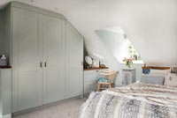 Modern country bedroom with built in wardrobes 