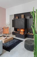 Lit fire in contemporary living room 