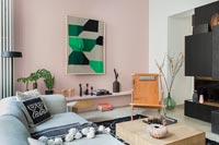 Pale pink painted feature wall in contemporary living room 