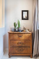 Wooden chest of drawers in modern bedroom 