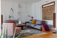 Modern living room with mural on wall