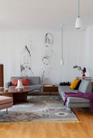 Modern living room with mural on wall